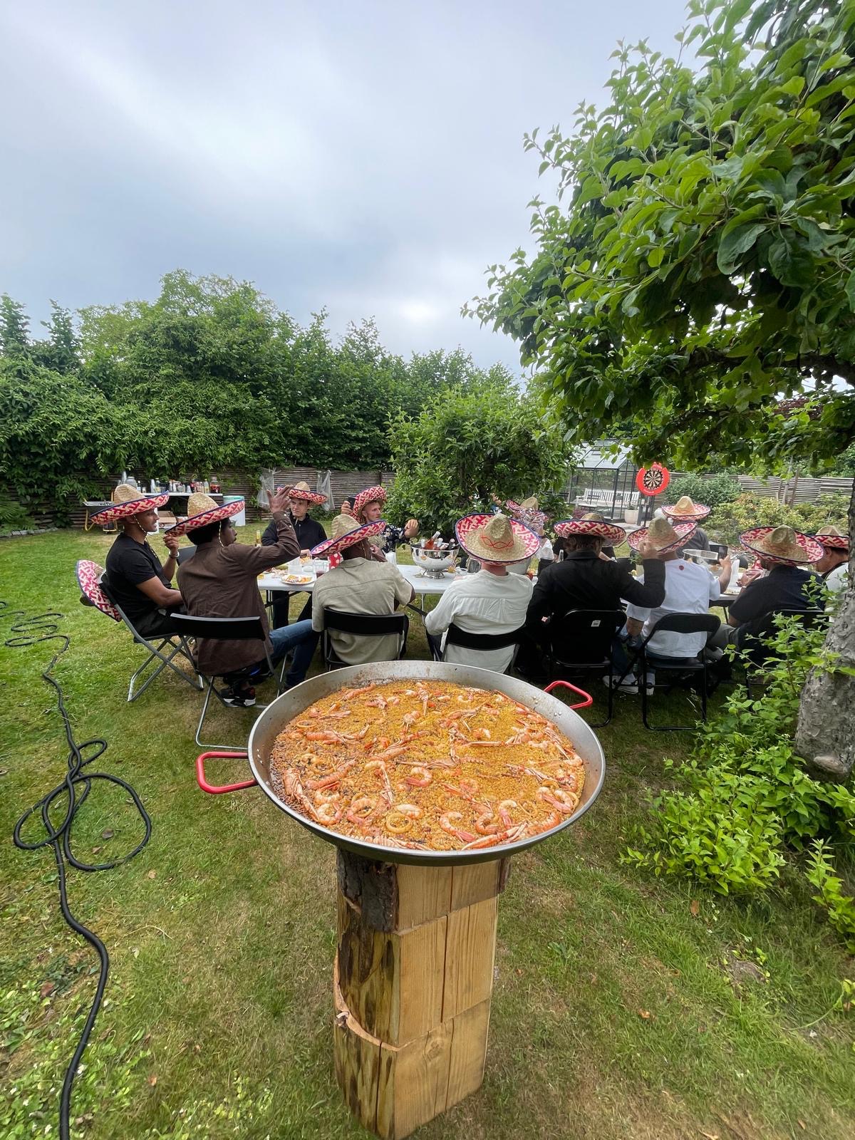 Private garden event with a giant paella