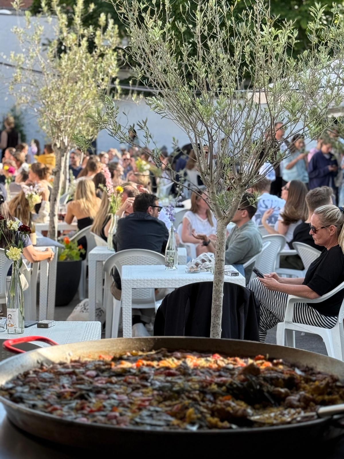 Vegetable paella served outdoors in a garden